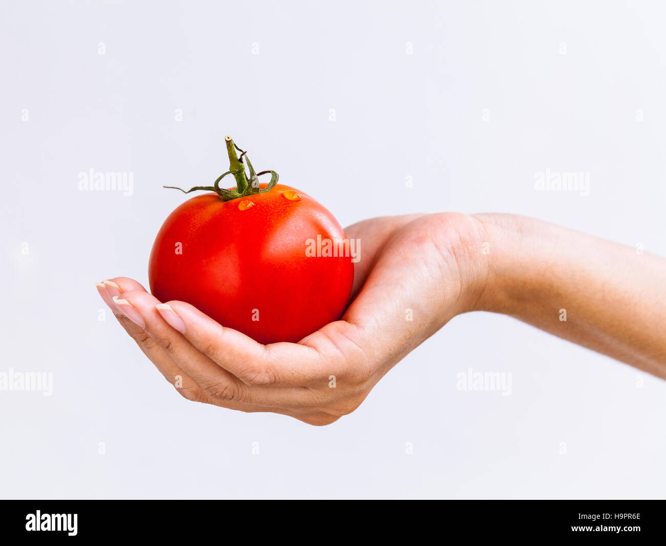 The Girl holding tomato. - Healthy food concept Stock Photo - Alamy