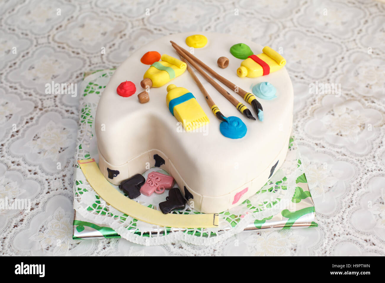 Paint brush art cake, chocolate sponge, fondant paintbrush, vibrant colors.