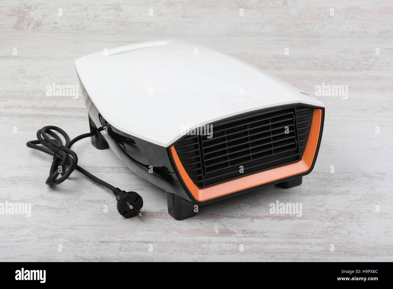 Electric heater on white laminate floor Stock Photo Alamy