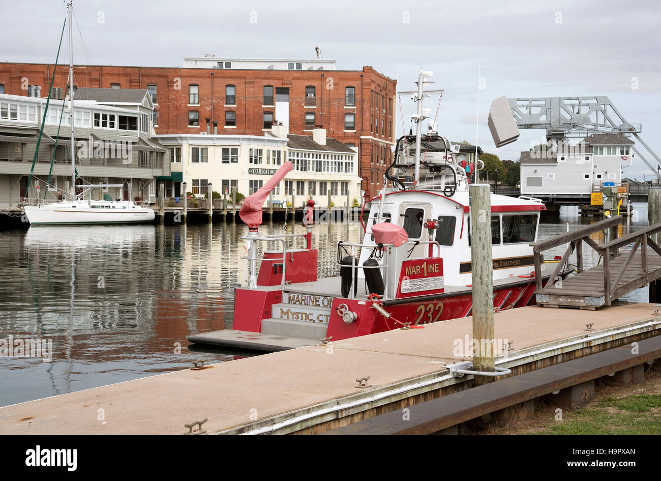 Mystic River Connecticut USA Fire Department boat moored alongside the