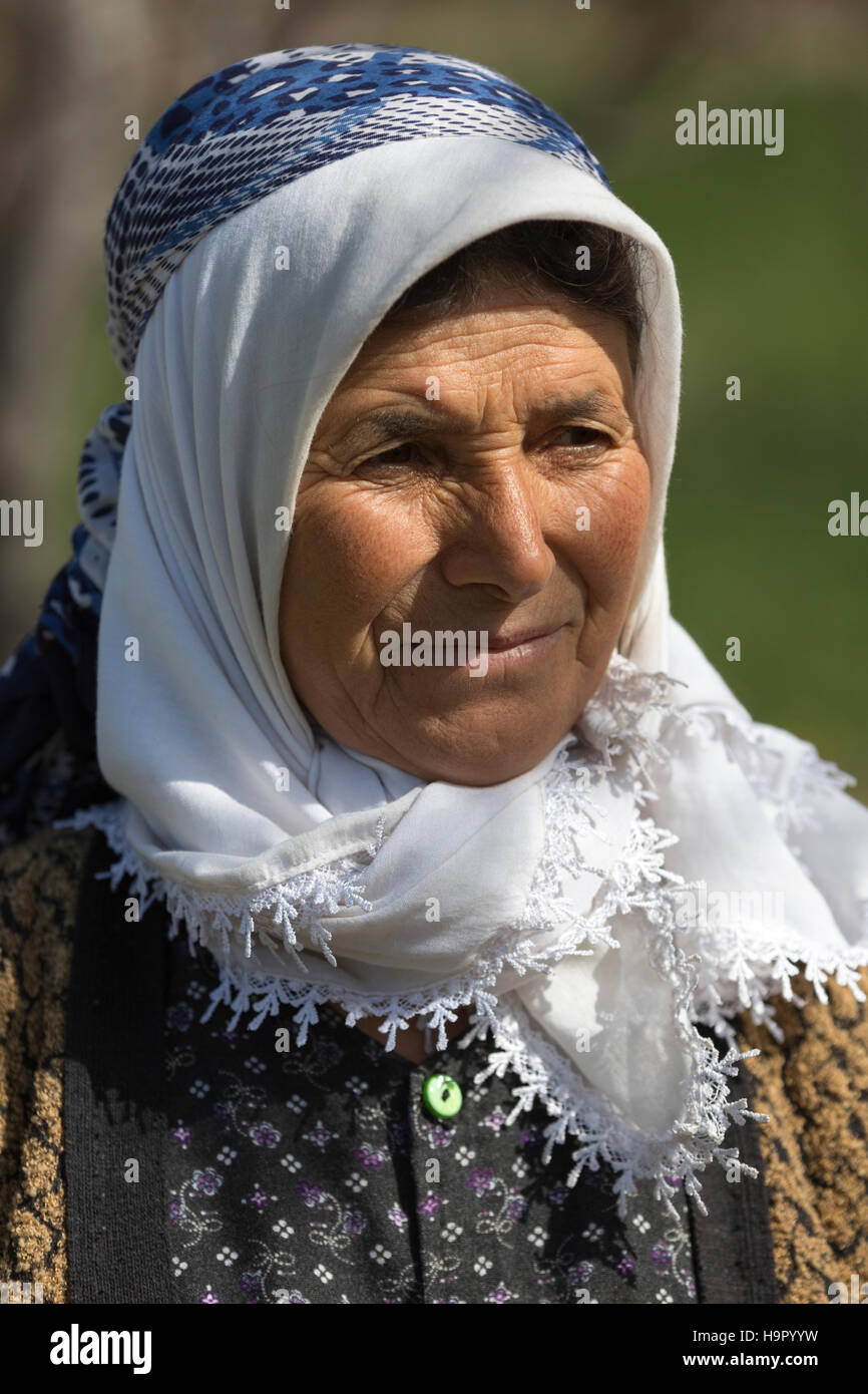 Elderly Turkish woman in traditional dress in the countryside of Konya, Turkey Stock Photo