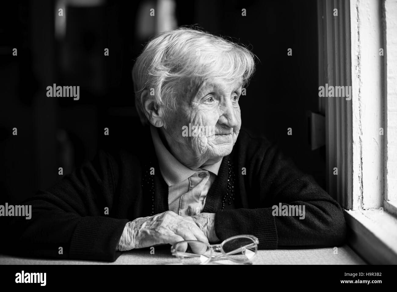 Aged woman 80-85 years, black and white photo. Stock Photo