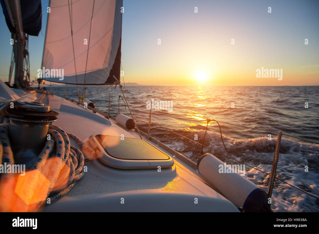 Sailing ship luxury yacht boat in the Sea during amazing sunset Stock ...