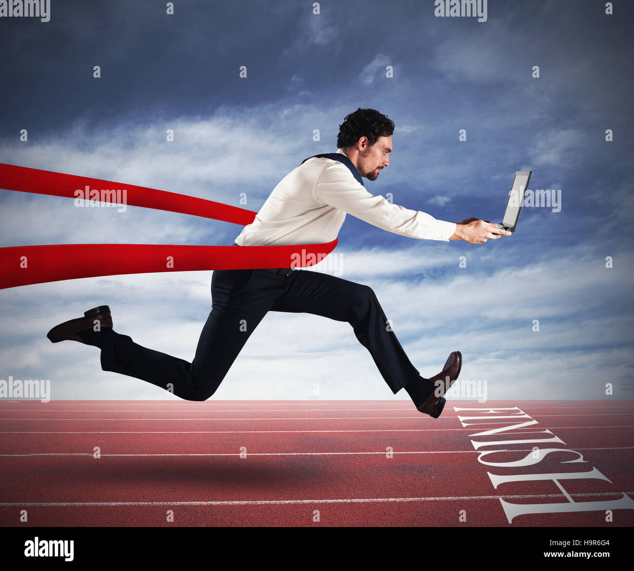 Successful businessman in a finishing line Stock Photo