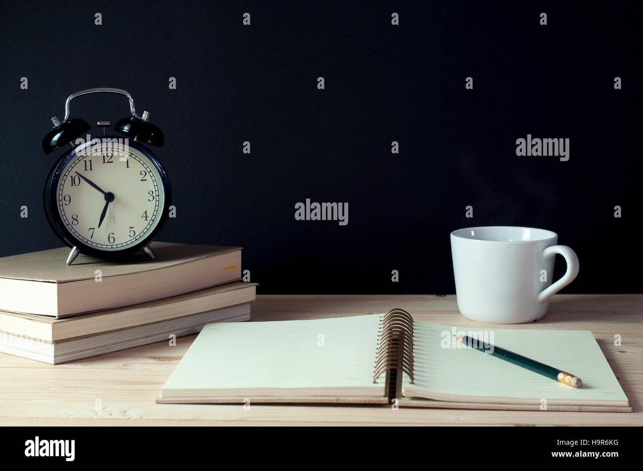 Image result for table with clock and pencil and books
