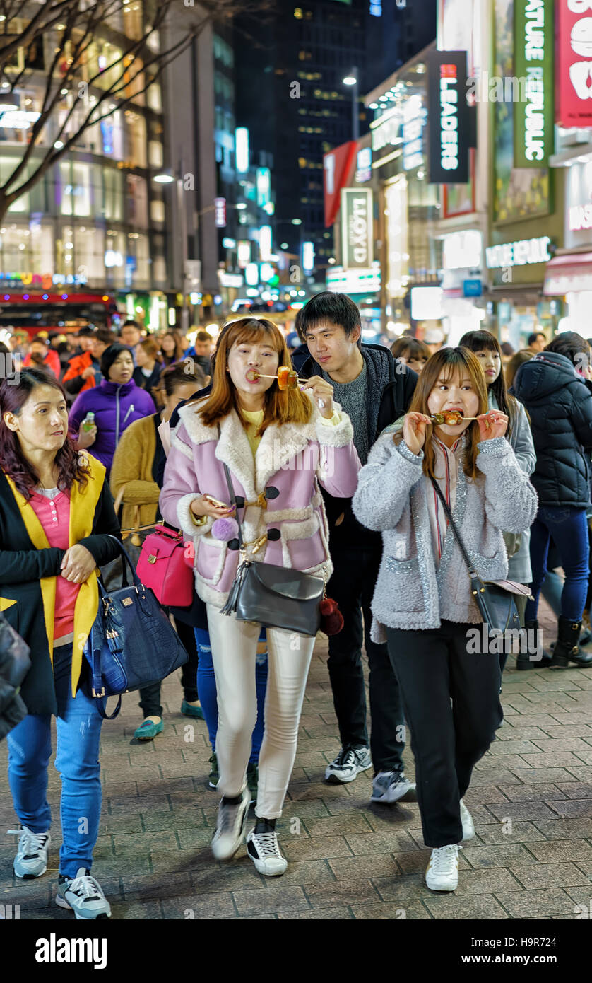 Seoul South Korea March 14 2016 Korean Girls Tasting Street Food Seoul South Korea March 14 2016 Korean Girls Tasting Street Food