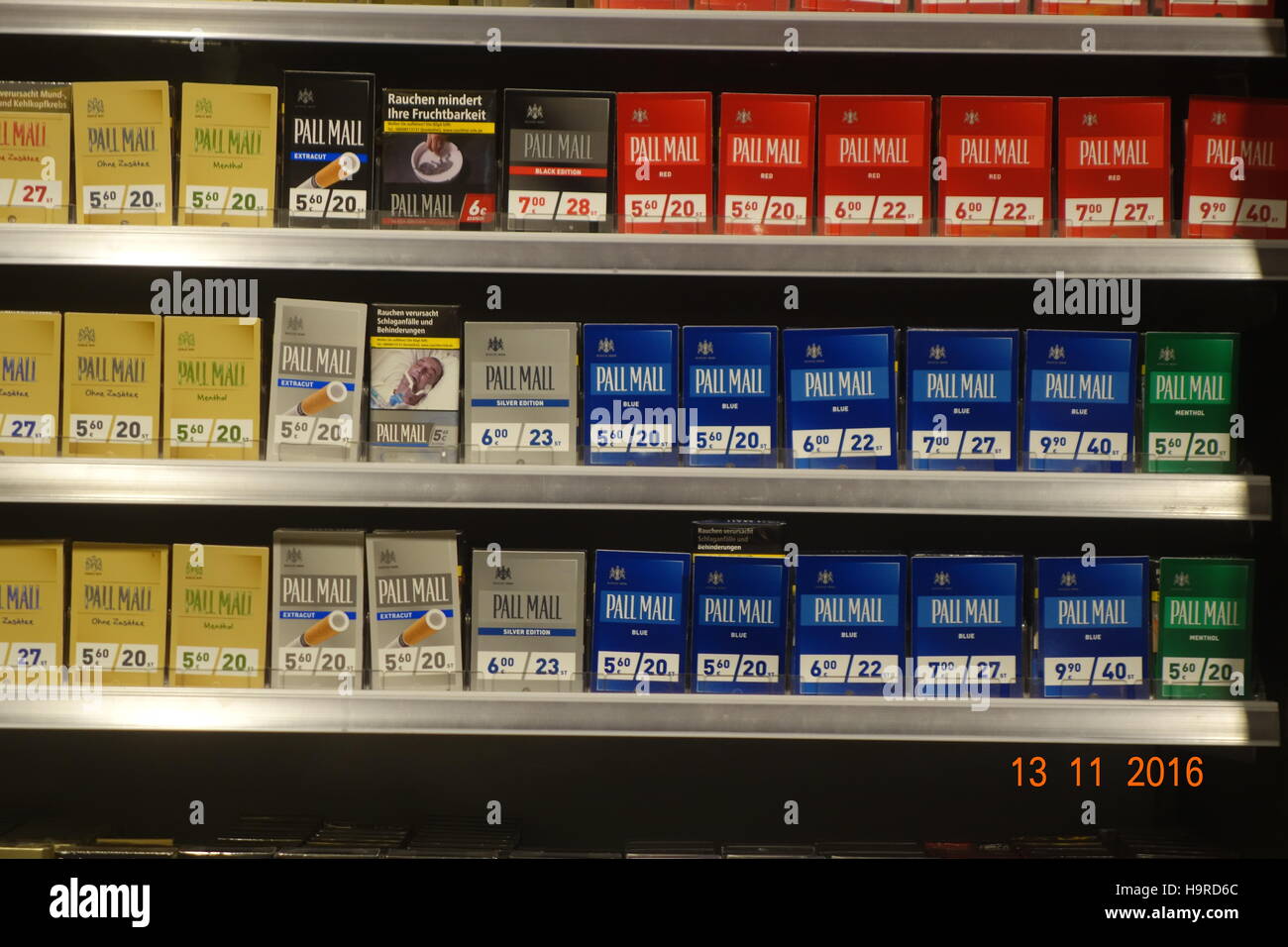 Potsdam, Germany. 13th Nov, 2016. HANDOUT - An undated handout photo of cigarette packs with mostly covered shock photos in a shop in Potsdam, Germany. - NO WIRE SERVICE - ATTENTION EDITORS: Editorial use only in connection with current reportings/ mandatory credit: Photo: Johannes Spatz/Forum Rauchfrei/dpa) Photo: Johannes Spatz/Forum Rauchfrei/dpa/Alamy Live News Stock Photo