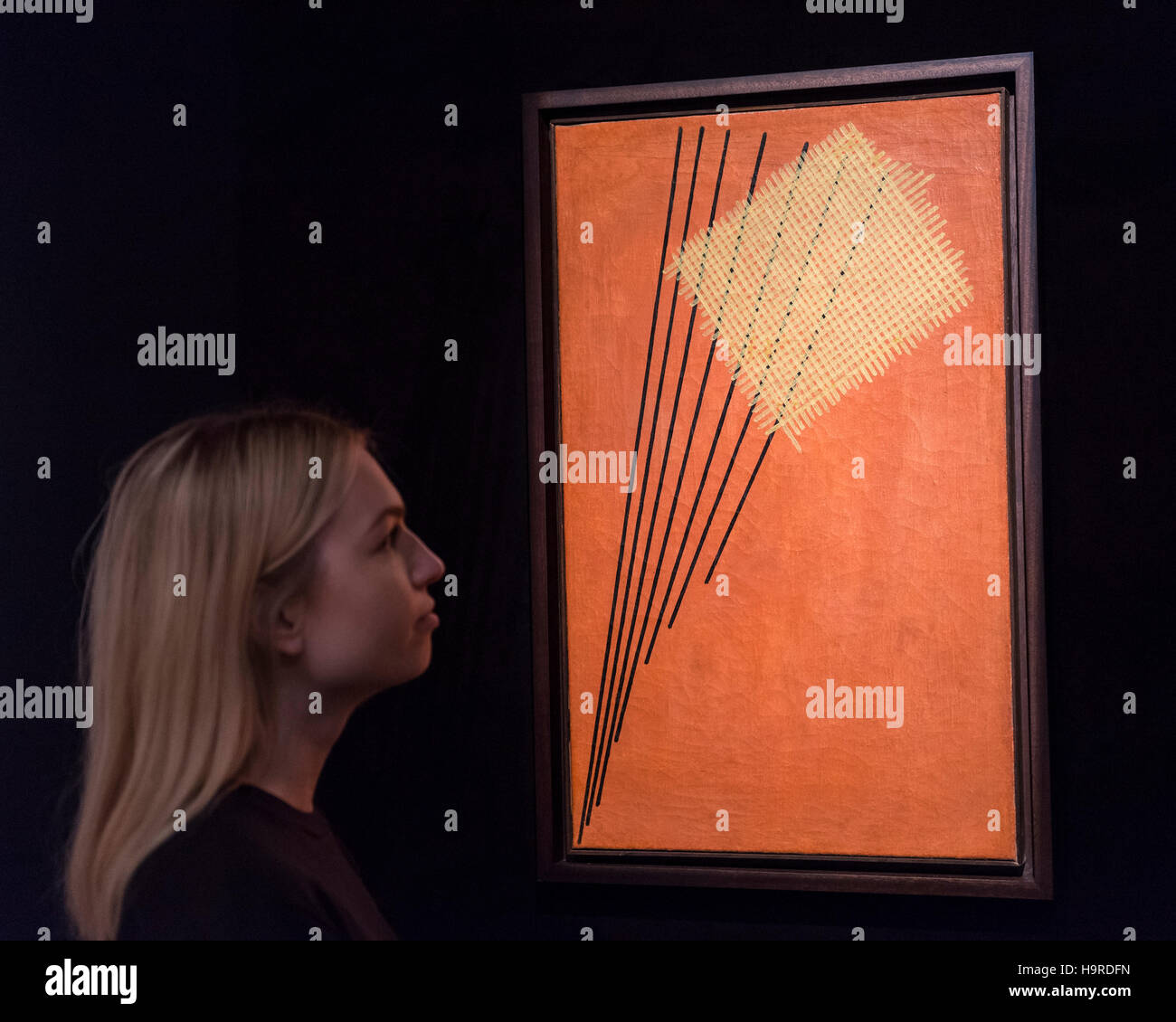 London, UK. 25th Nov, 2016. A staff member views 'Construction No. 95' by Alexander Rodchenko (est. GBP 2.5-3.5m), at the preview of artworks from Sotheby's upcoming Russian sales in New Bond Street, where over three hundred works spanning several centuries will be offered. Credit:  Stephen Chung/Alamy Live News Stock Photo