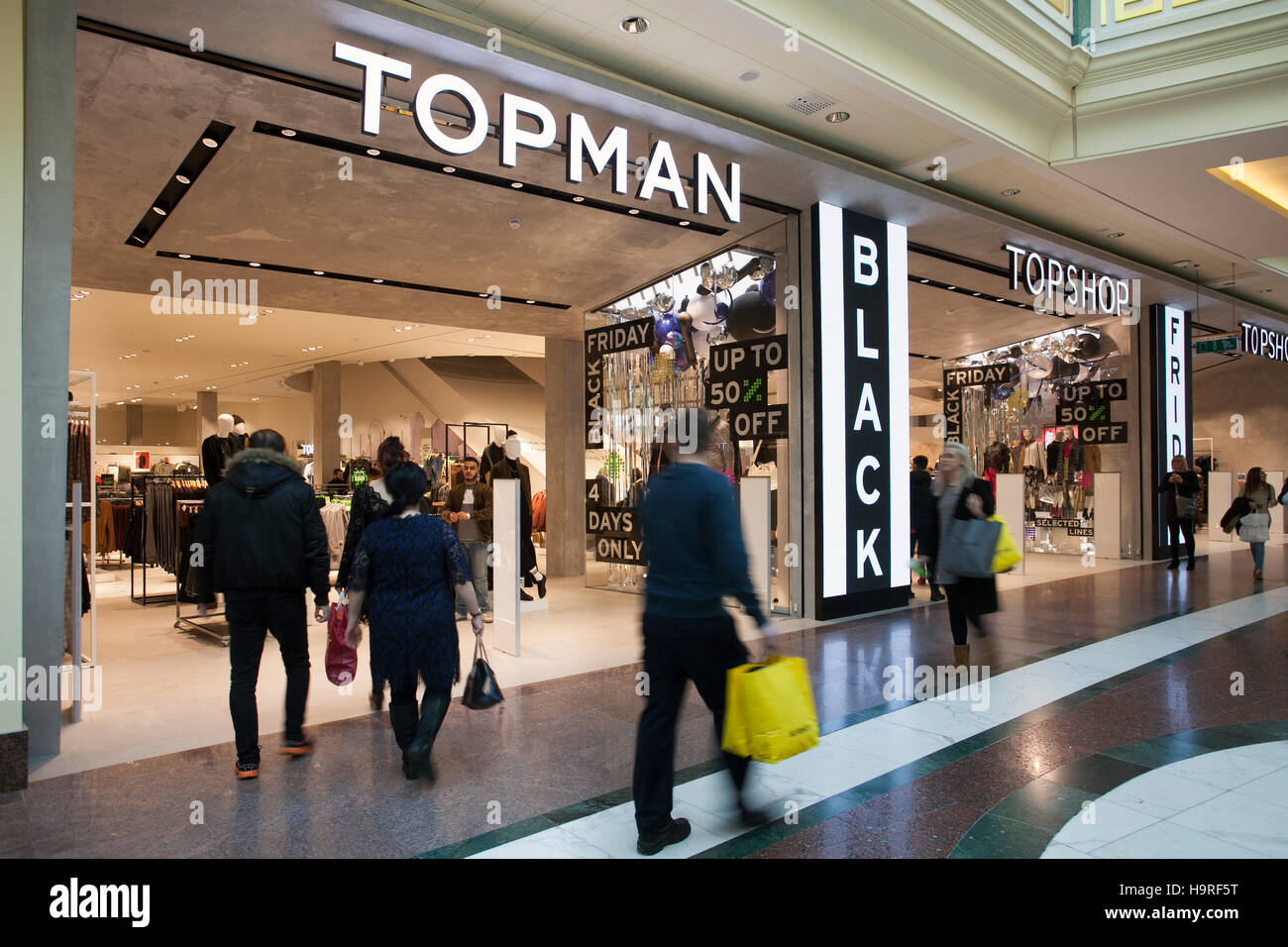 Topman & Topshop stores in INTU Trafford Centre Manchester. UK November,  2016. Black Friday Sales Weekend. City centre holiday shopping season,  retail shops, stores, Christmas shoppers, discount sale shopping, and  consumer spending