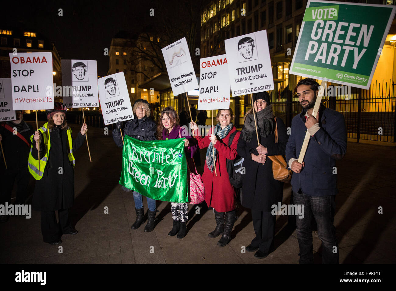 London, UK. 25th November, 2016. Activists from the Campaign Against Climate Change protest outside the US Embassy in solidarity with American climate activists preparing to campaign against President Elect Donald Trump and also in solidarity with those protesting at Standing Rock. Credit:  Mark Kerrison/Alamy Live News Stock Photo