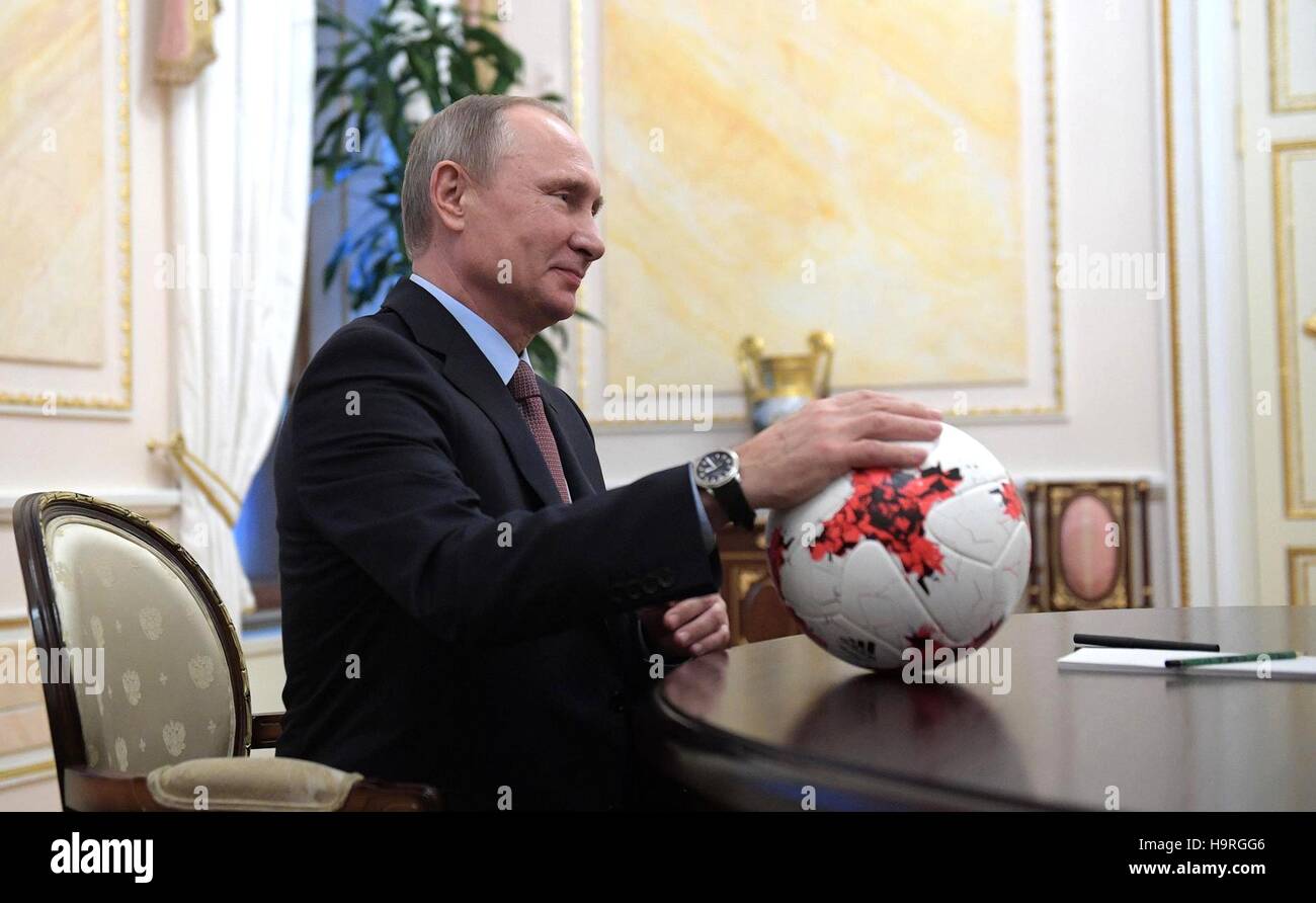 Moscow, Russia. 25th Nov, 2016. Russian President Vladimir Putin holds a soccer ball given him by FIFA president Giovanni Infantino during their meeting at the Kremlin November 25, 2016 in Moscow, Russia. Credit:  Planetpix/Alamy Live News Stock Photo