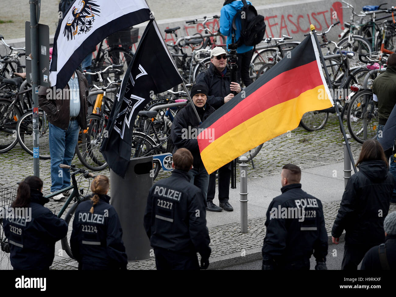 Berlin, Germany. 26th Nov, 2016. Participants in a demo by the Berlin offshoot of the Pegida movement 'Baergida' are provented from moving further by police, in Berlin, Germany, 26 November 2016. Several dozen people gathered for a demonstration. Photo: Rainer Jensen/dpa/Alamy Live News Stock Photo