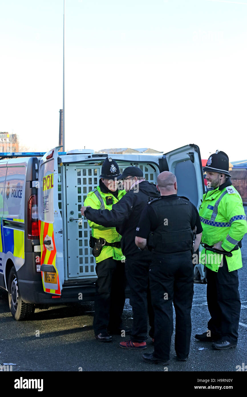 Bolton, Lancashire, UK. 26th November, 2016. A man is searched by Police during a protest against the building of a Mosque in Bolton, Lancashire, UK. 26th Nov, 2016. Credit:  Barbara Cook/Alamy Live News Stock Photo