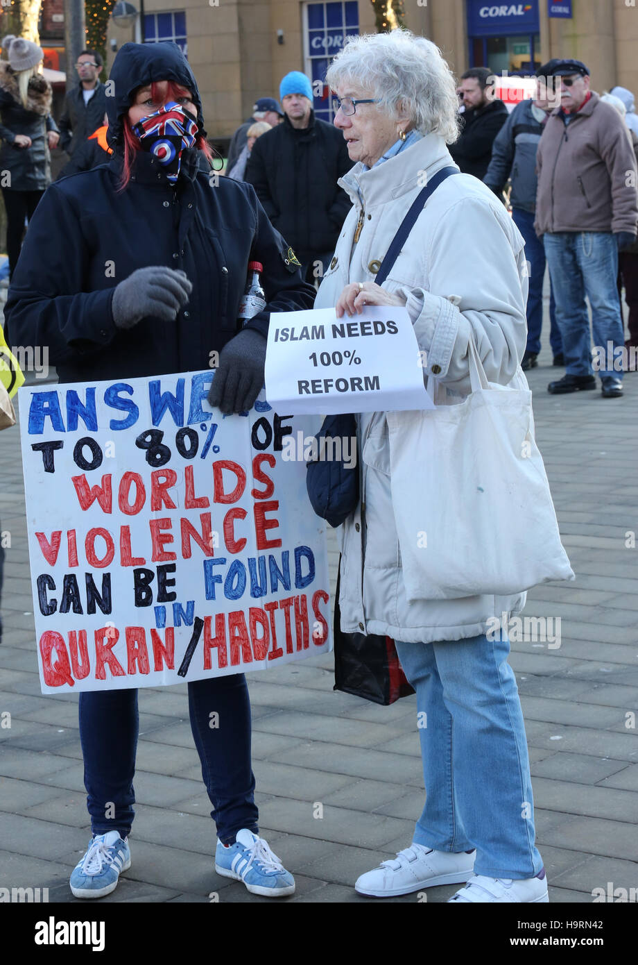 Bolton, Lancashire, UK. 26th November, 2016. A women holding a leaflet which reads 'Islam needs 100% reform', Bolton, Lancashire, UK. 26th Nov, 2016. Credit:  Barbara Cook/Alamy Live News Stock Photo