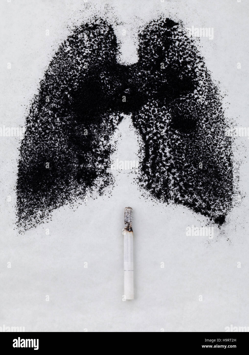 Shape of lungs with charcoal powder and cigarette on white backg Stock Photo