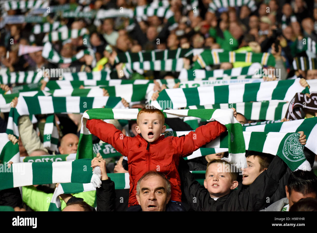 Celtic fans hold up scarves as they sing you'll never walk alone during the  UEFA Champions League, Group C match at Celtic Park, Glasgow. PRESS  ASSOCIATION Photo. Picture date: Wednesday September 28,