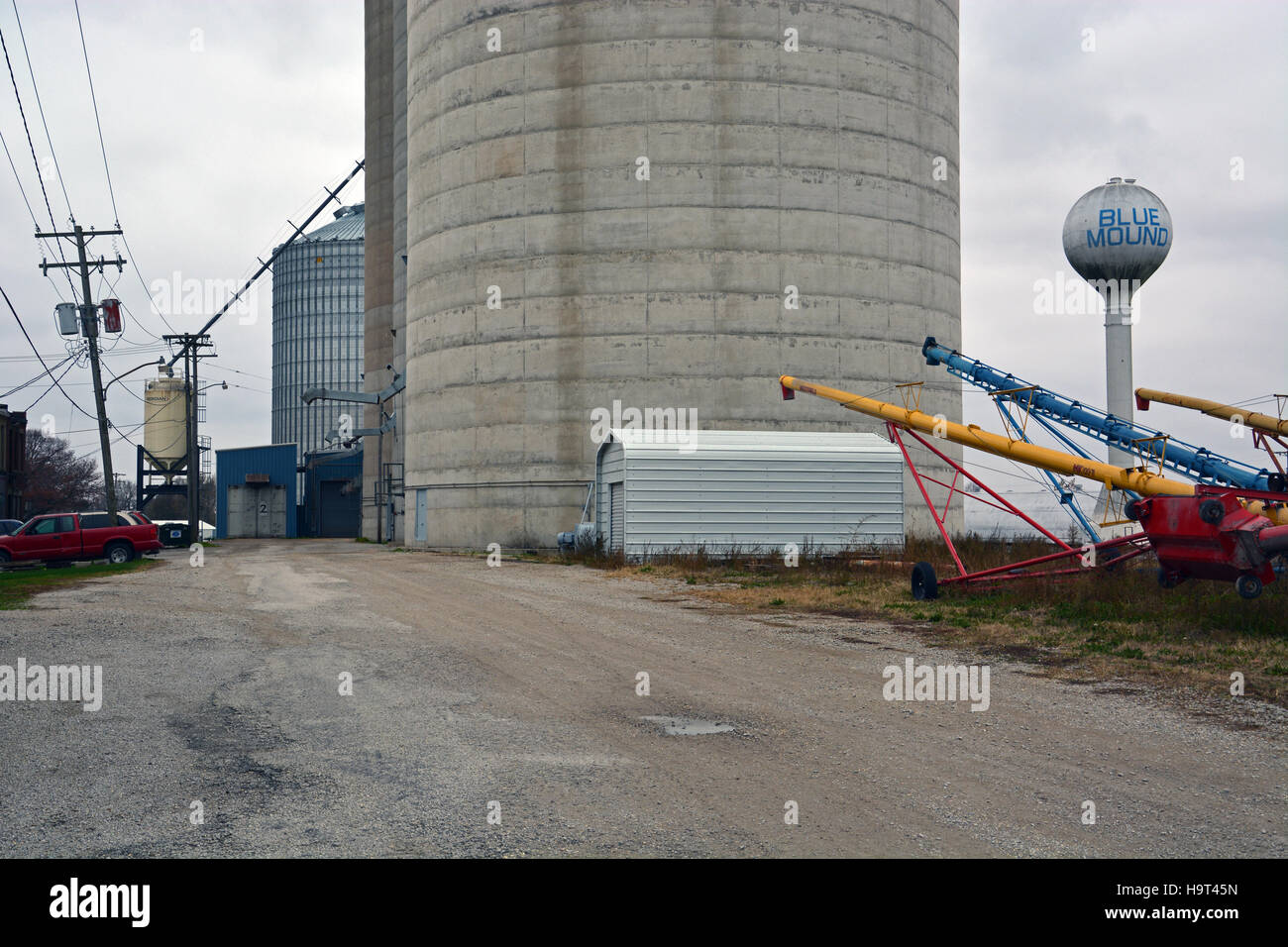 A corn and grain silo located off Route 48 under cold gray November skies in the Central Illinois town of Blue Mound. Stock Photo