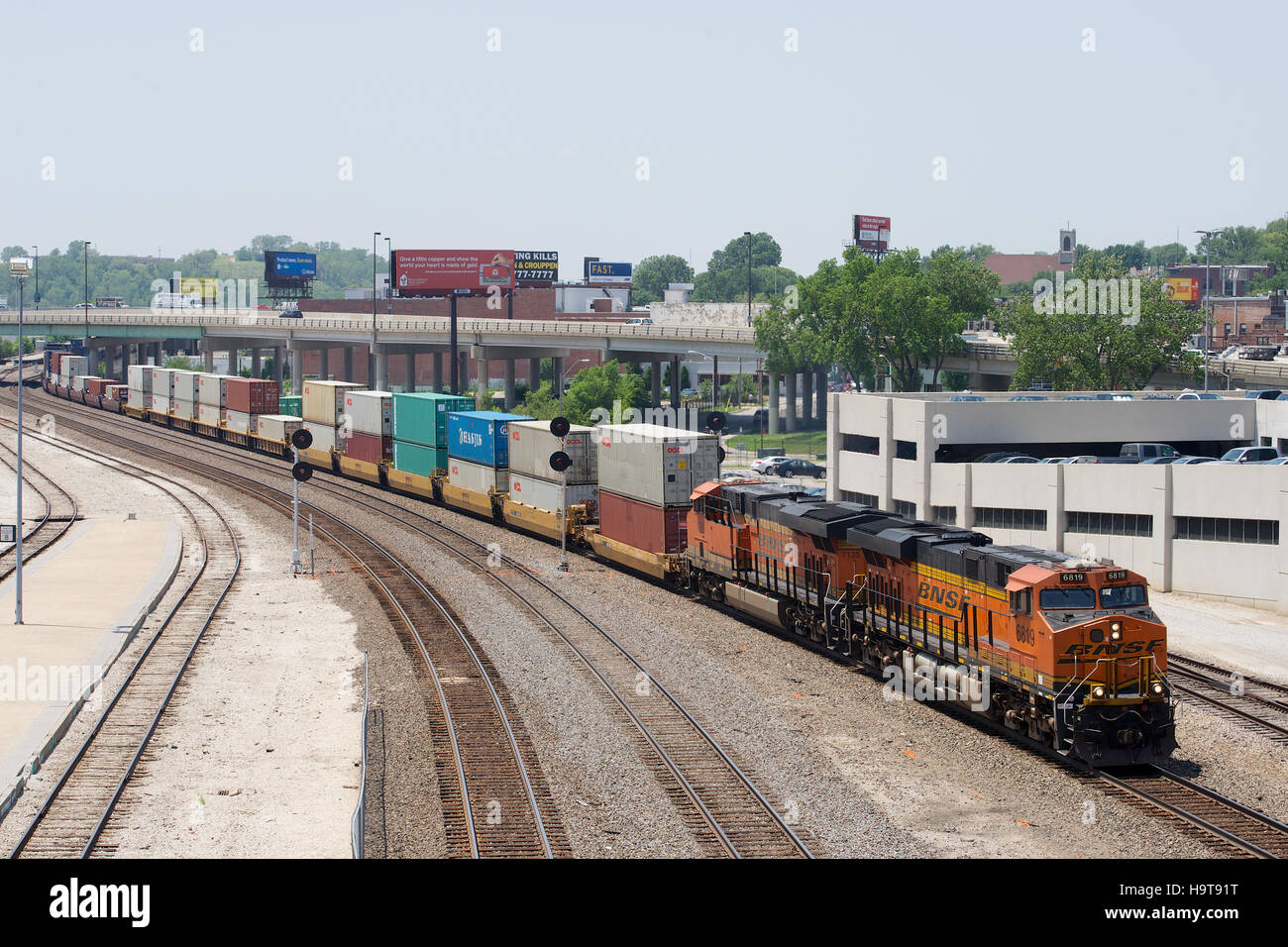 BNSF operated intermodal double-stack train heads through Union Station, Kansas City, Missouri, USA. Stock Photo