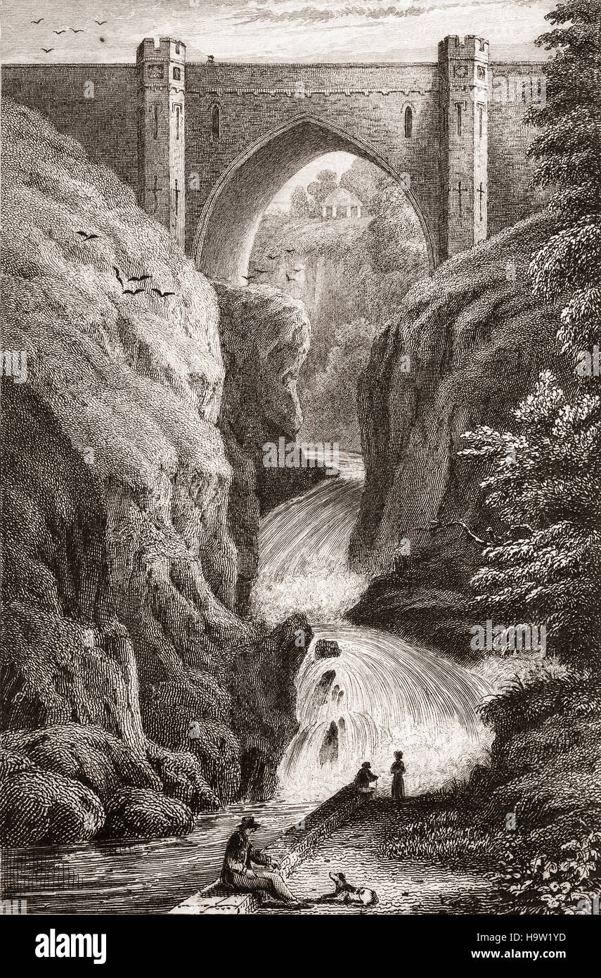 19th Century view of Poulaphouca, (Irish: Poll an Phúca, meaning 'the Púca's hole'). It's the name of a waterfall and bridge on the River Liffey in County Wicklow, Ireland.  The waterfall has little water running over it any longer because of a hydroelectric project. Stock Photo