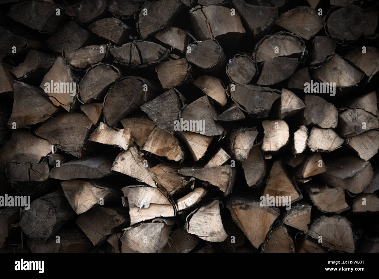 Stack of old chopped fire wood Stock Photo - Alamy