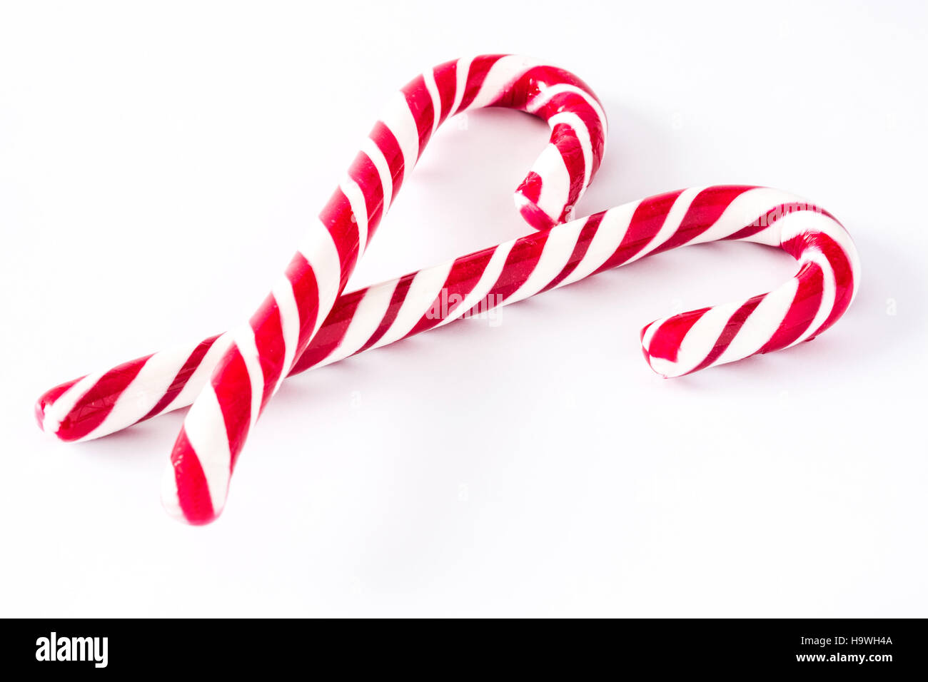 Candy canes isolated on white background Stock Photo - Alamy