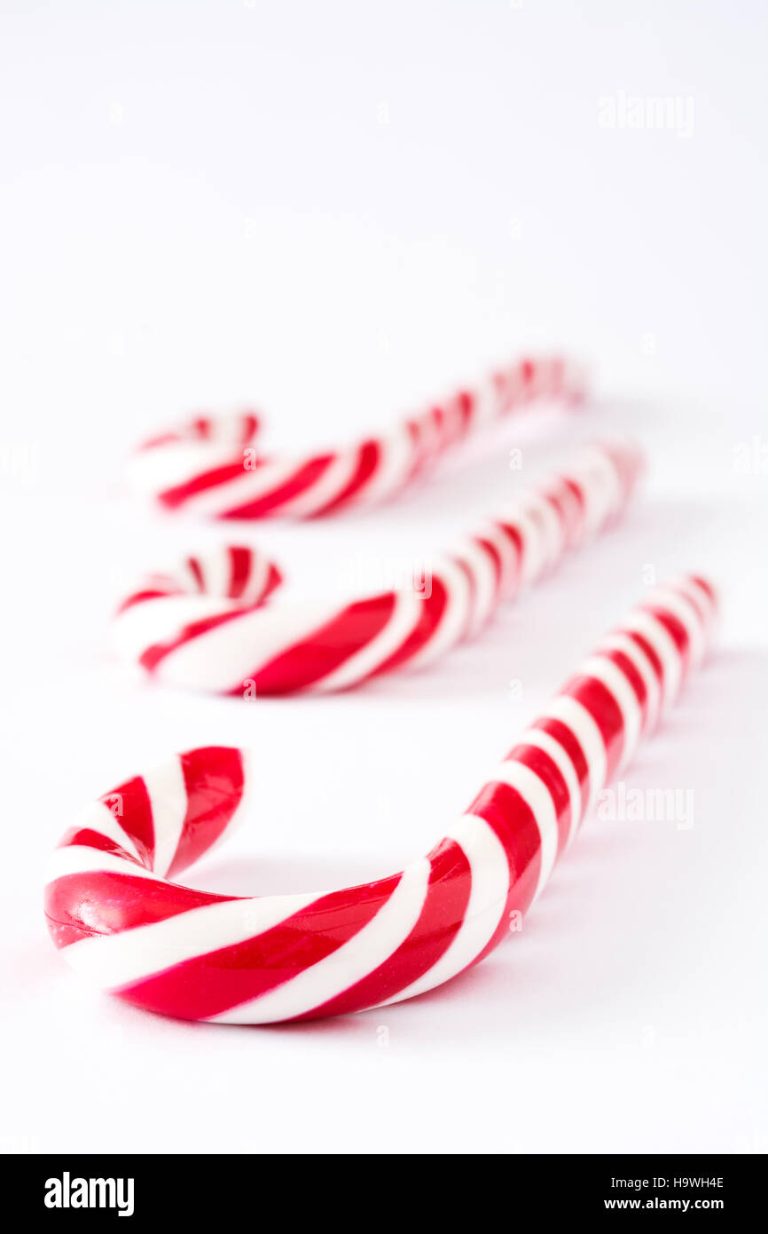 Candy canes isolated on white background Stock Photo - Alamy