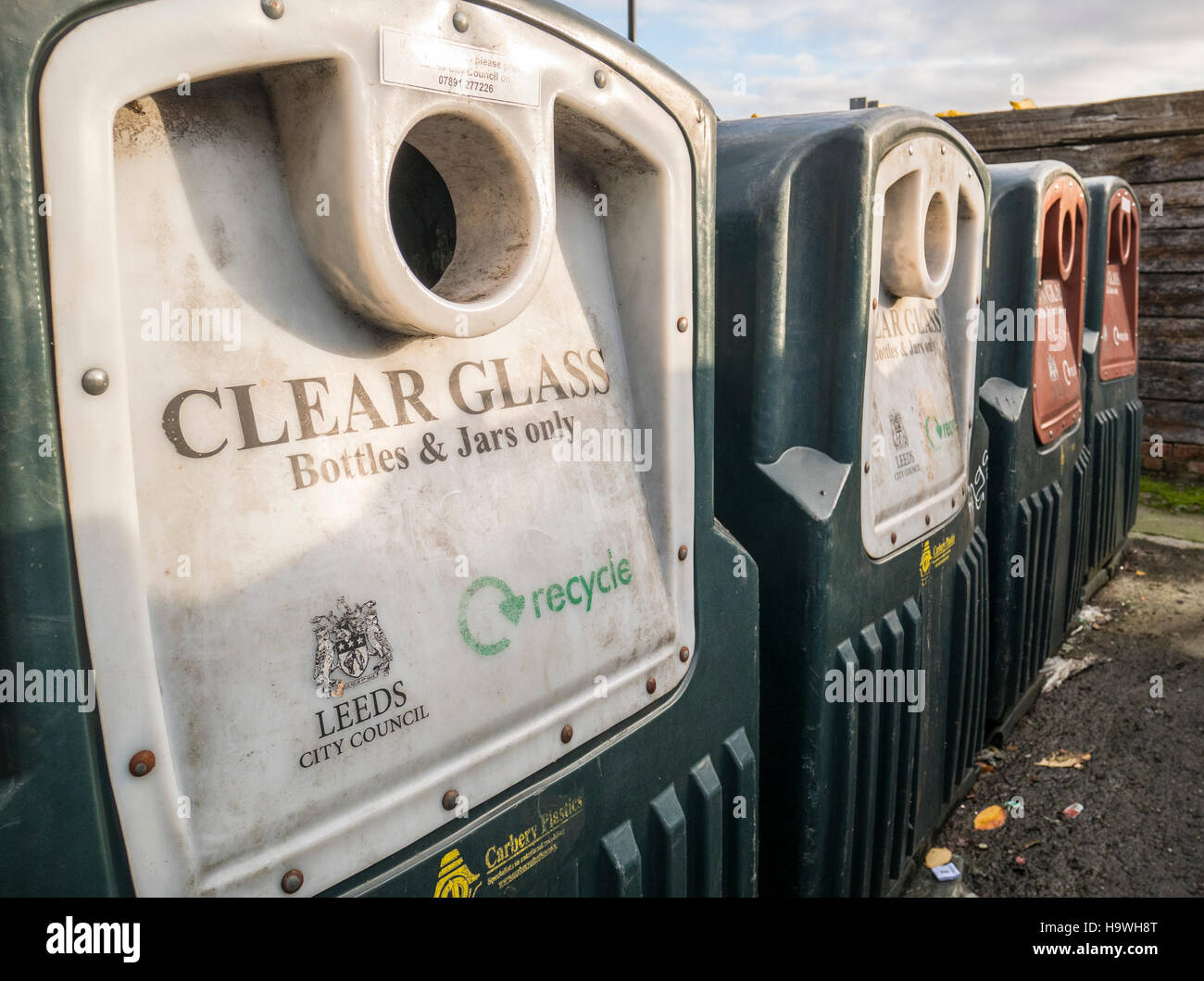 Clear glass bottle & jar recycling waste bins provided by Leeds City Council, in Otley, Leeds, West Yorkshire Stock Photo