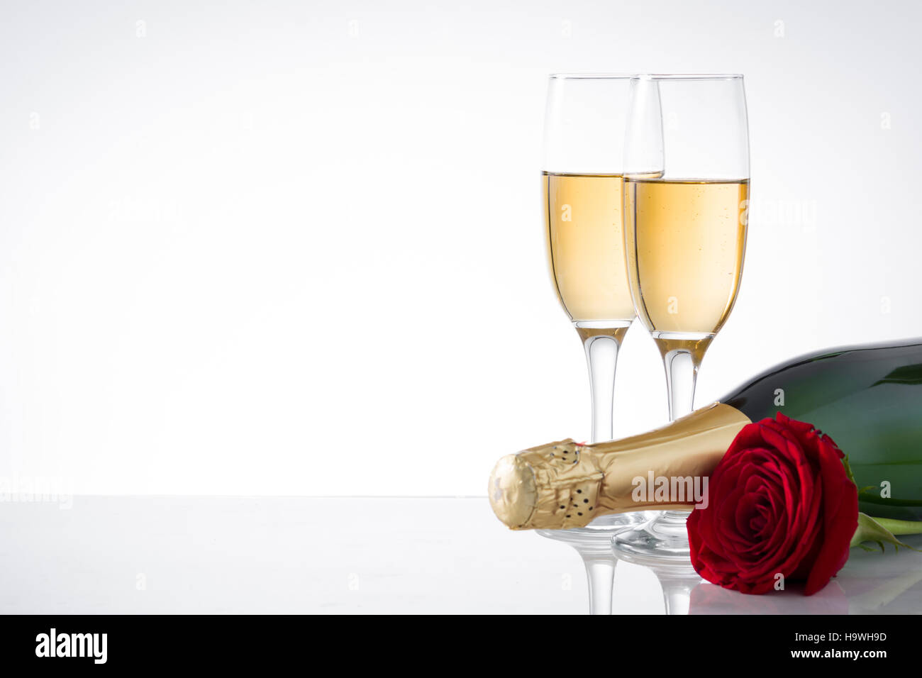 Champagne and red roses on hi-res stock photography and images - Alamy