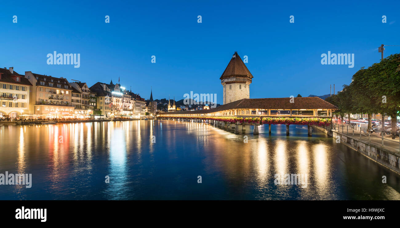 world heritage Chapel Bridge  at dusk, river Reuss, Lucerne, Switzerland Stock Photo