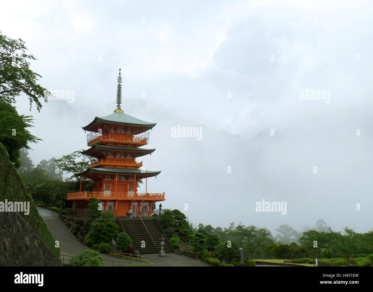 Beautiful Red Color Three-storied Pagoda in the Mist, the Mountainside of Wakayama City, Japan Stock Photo