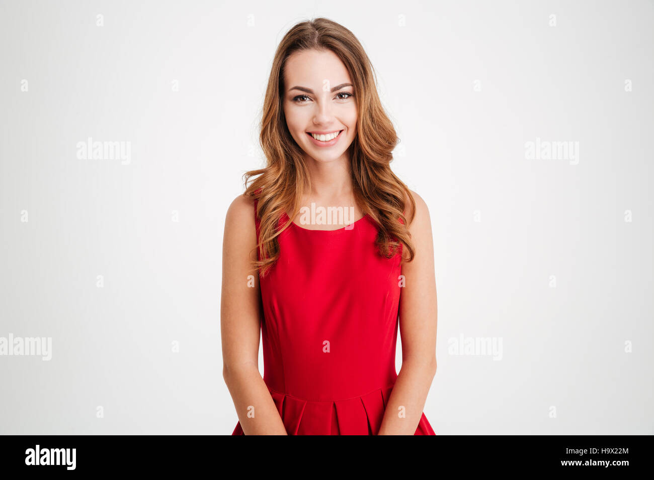 Portrait of a cheerful smiling pretty woman in red santa claus costume ...
