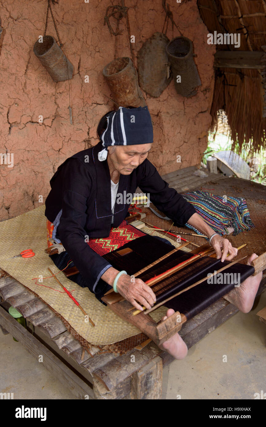 weaving in the Village Binlang of Li and Miao minorities near Sanya, Hainan island, China Stock Photo
