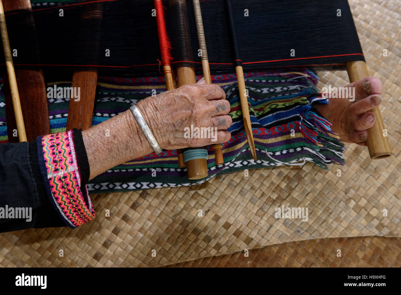 weaving in the Village Binlang of Li and Miao minorities near Sanya, Hainan island, China Stock Photo