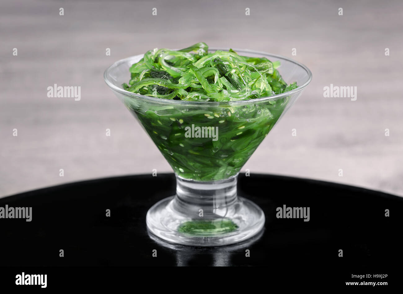 Seaweed in a glass vase Stock Photo