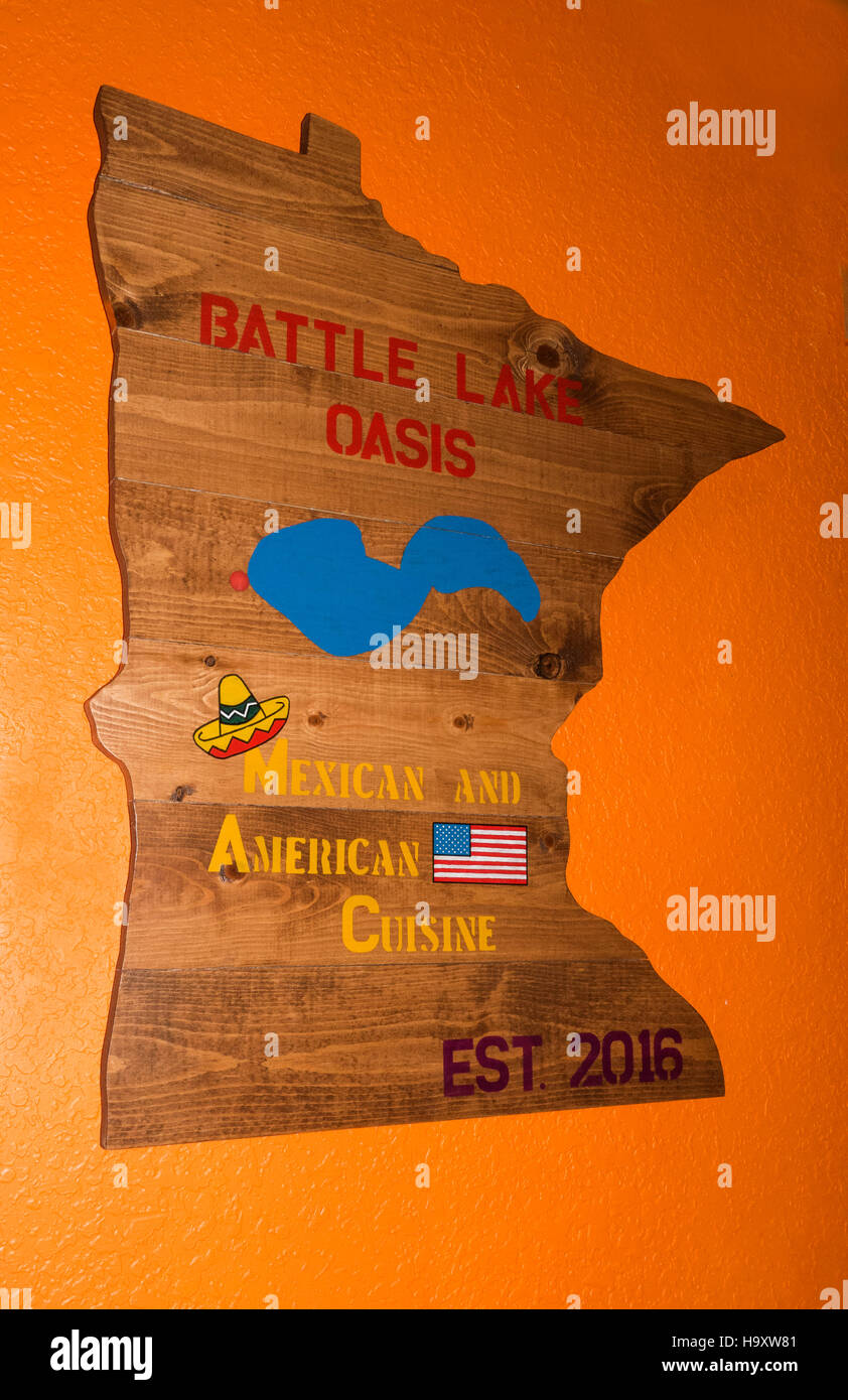 Wood cut out of state of Minnesota advertising location of Battle Lake Oasis Mexican Restaurant. Battle Lake Minnesota MN USA Stock Photo