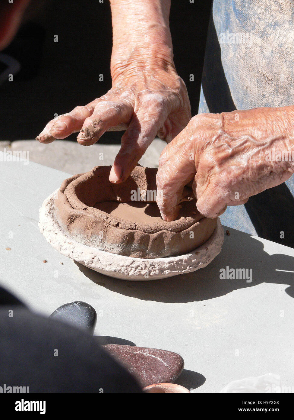 Bandelier National Monument showcases ancestral Pueblo pottery-making techniques, reflecting the rich cultural history of the area. Visitors can learn about traditional methods and their connection to the land and community. Stock Photo