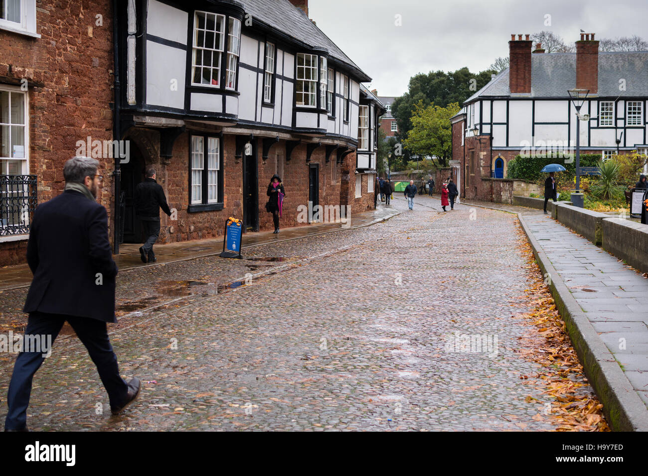 Exeter, England, UK - 22 November 2016: Unidentified people walk on Cathedral Cl street in Exeter. Stock Photo