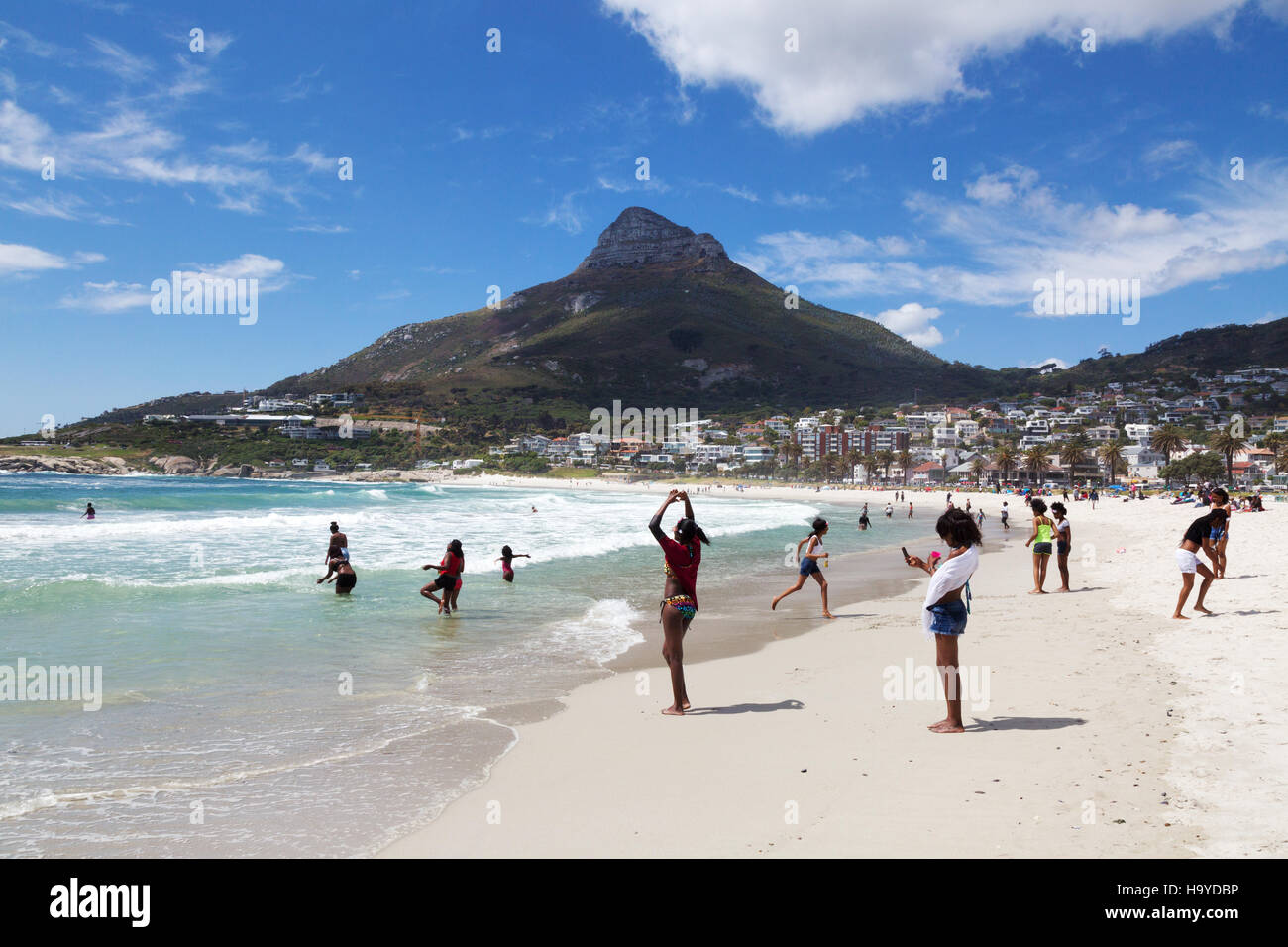 local people on Camps Bay Beach, Cape Town, South Africa Stock Photo