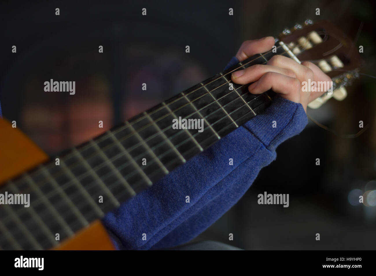 Close up of teen playing guitar Stock Photo