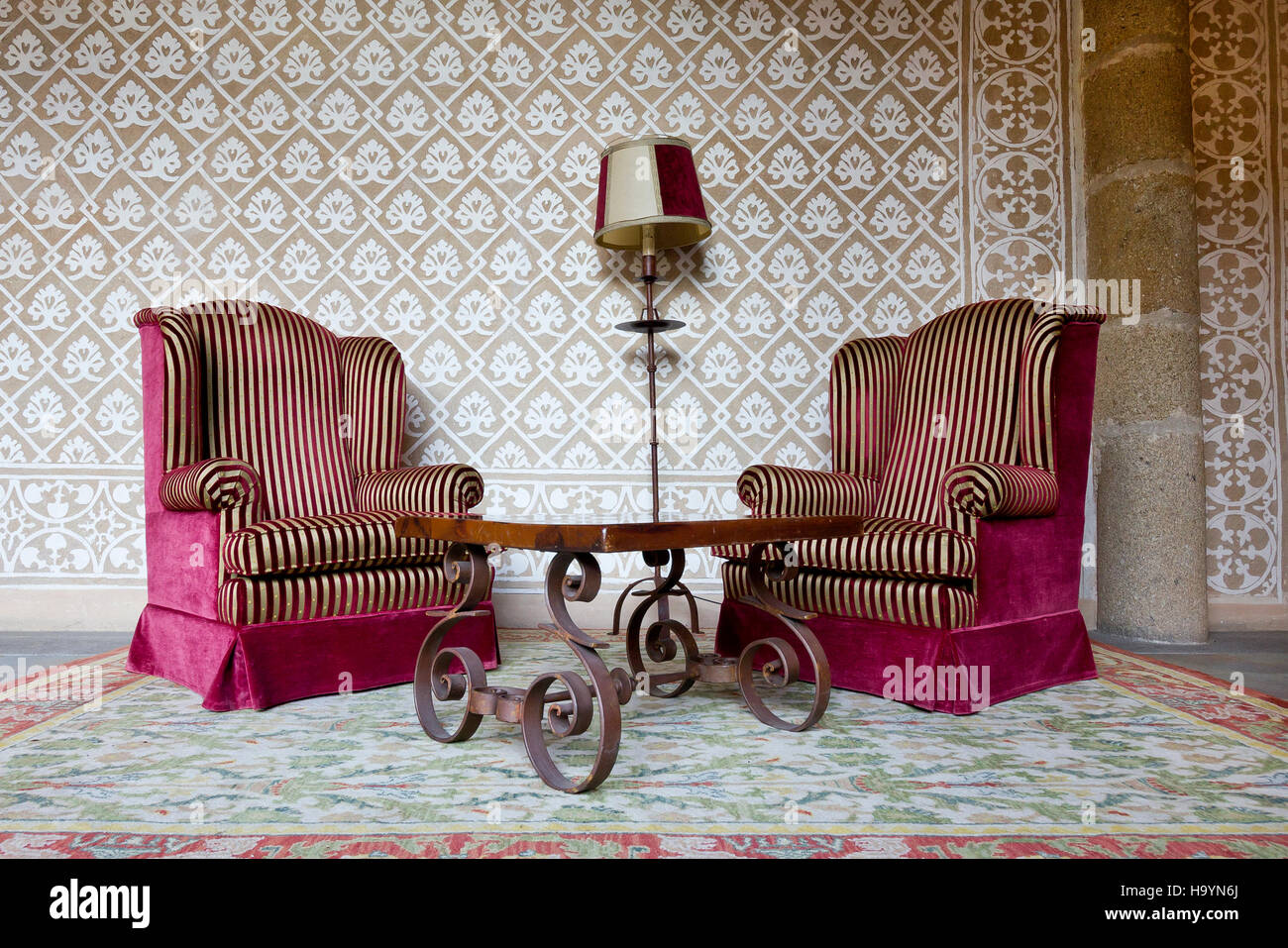 Vintage Waiting Room With Two Red And Golden Stripes Wing Chairs