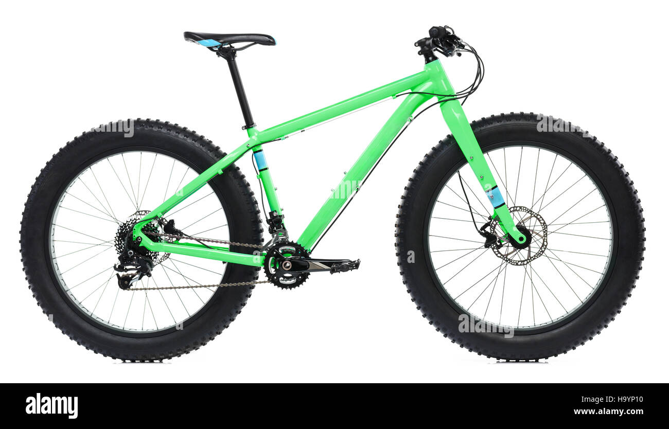 New green bicycle with thick tires for snow ride isolated on a white