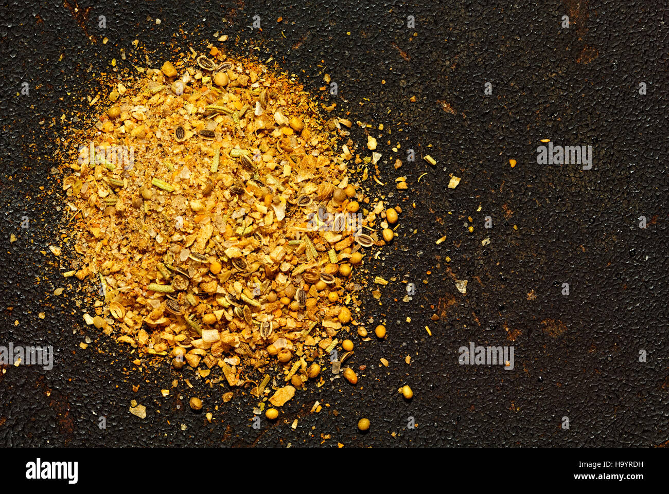 Seasoning mix on a dark textured background Stock Photo