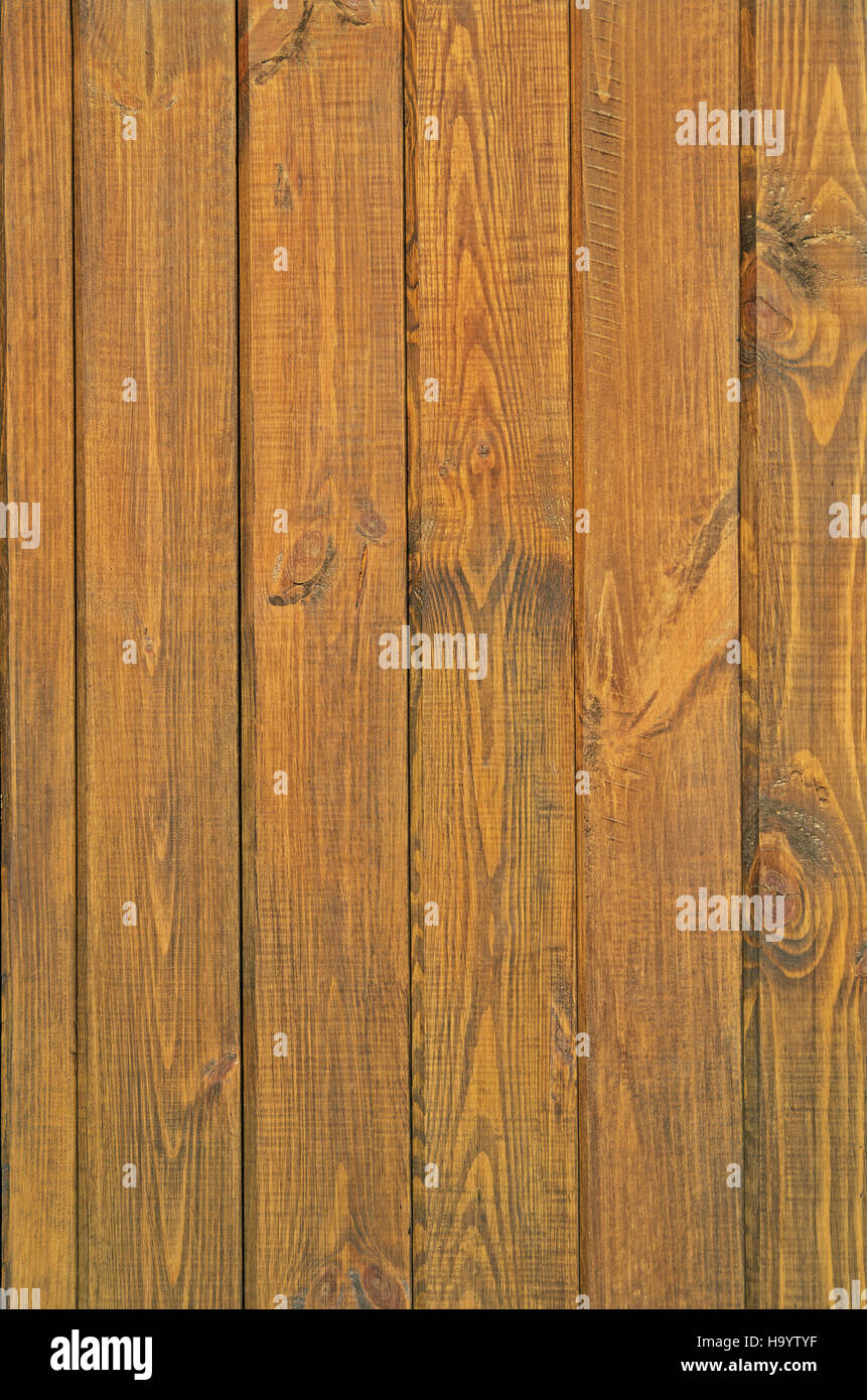 Pine Boards Treated With Wood Stain To Protect Against External