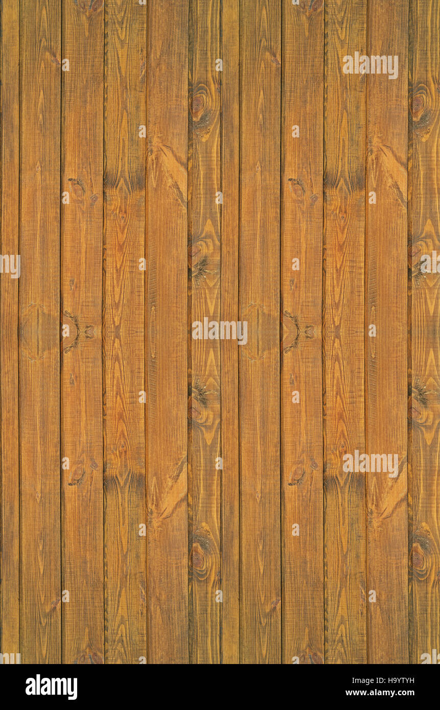 Pine boards treated with wood stain to protect against external