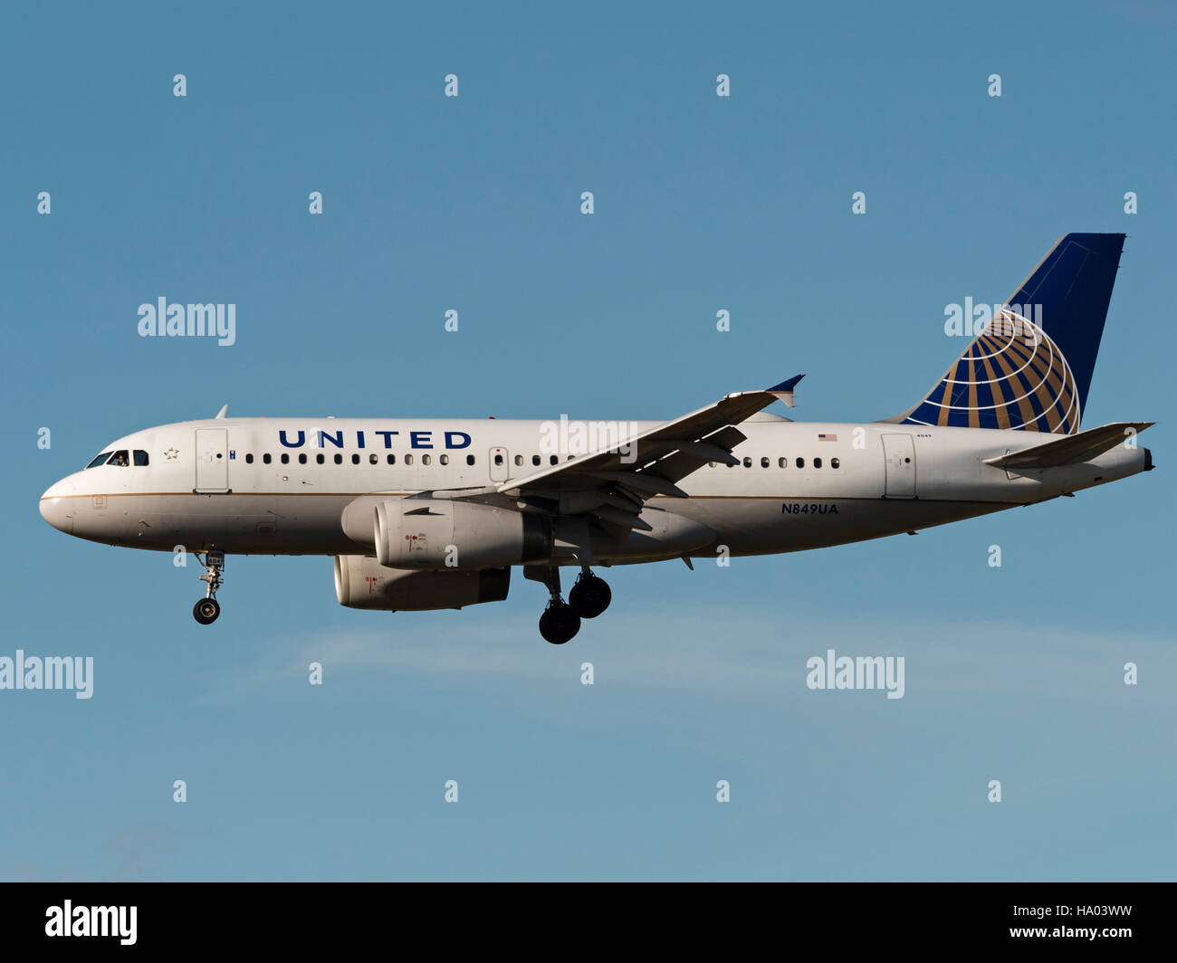 United Airlines plane jet airplane airliner Airbus A319 airborne final approach landing jetliner airline company aeroplane Stock Photo