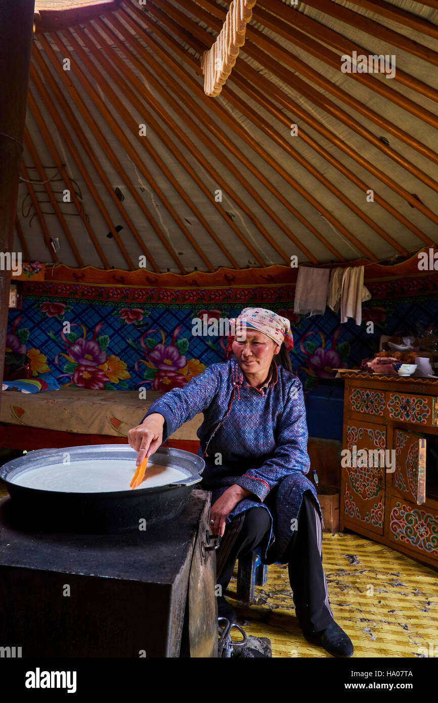 Mongolia, Arkhangai province, nomad woman brewing milk in the yurt Stock Photo