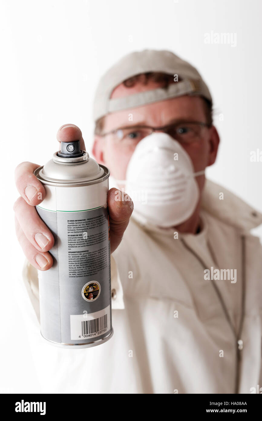 Painter with a spray can and breathing protection Stock Photo - Alamy