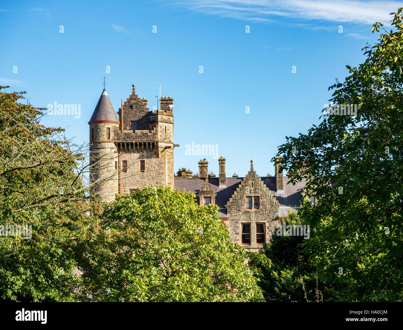 Belfast castle among trees. Tourist attraction on the slopes of