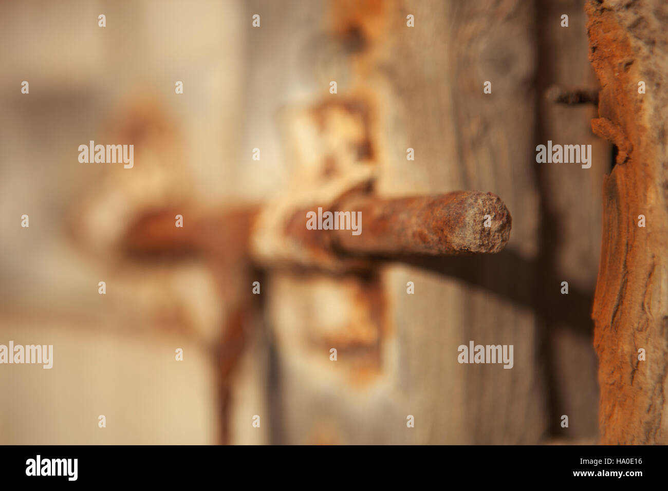 Closed rusty on an old wooden door Stock Photo - Alamy