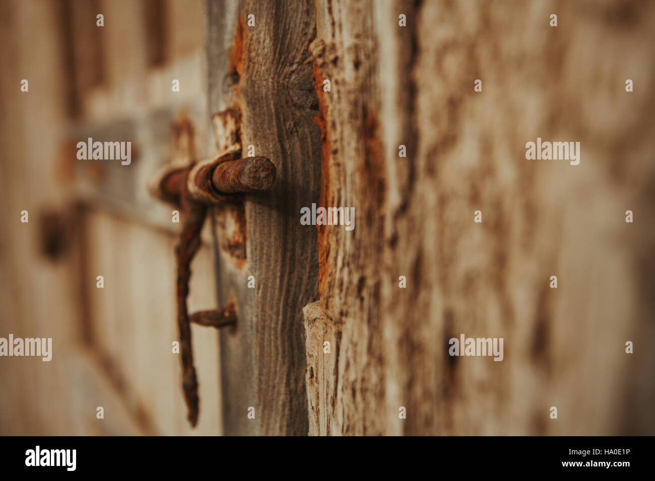 Closed rusty on an old wooden door Stock Photo - Alamy